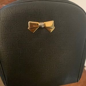 Nina Ricci Black shoulder bag with pretty bow accent and NR patterned